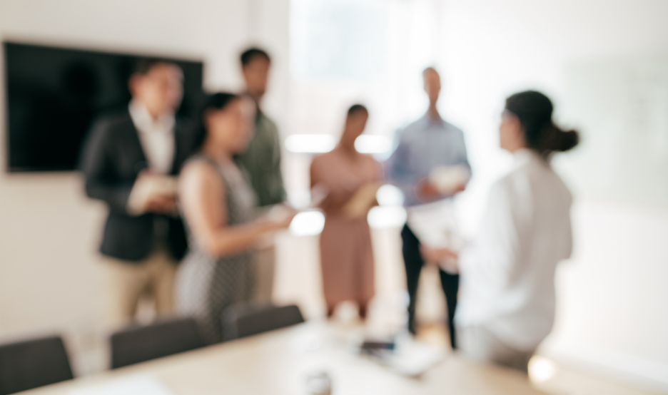group of people talking in office
